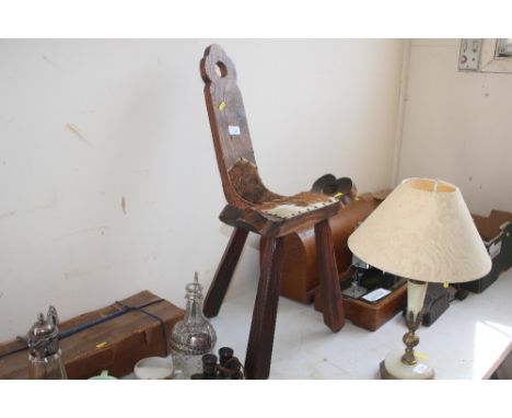 A pine and hide seated stool