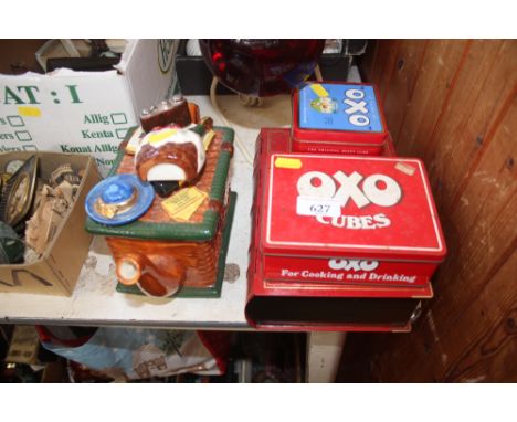 A quantity of Oxo tins and a novelty teapot 