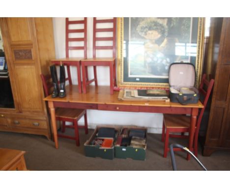A pine table raised on turned supports; together with a set of four ladder back dining chairs