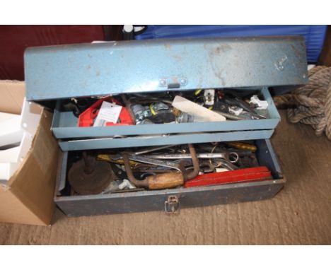 A metal tool box and contents of various hand tools