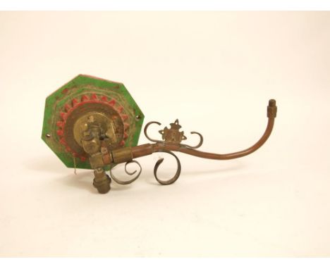 A reclaimed Gothic revival wall mounted gas light with single adjustable arm the stepped octagonal wooden bracket with geomet
