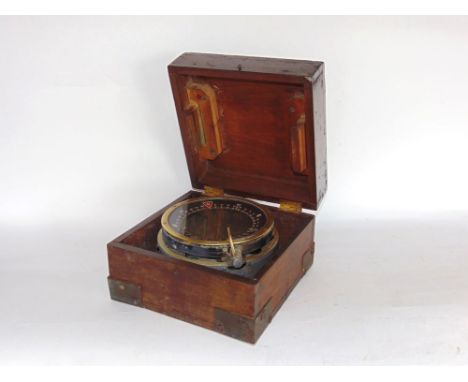 An oak cased military brass field compass inscribed 'TWPE P4A No 11579T'.