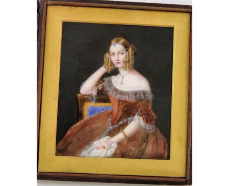 A good quality 19th century portrait miniature of rectangular form showing a three quarter length study of an elegant seated 