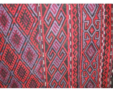 Large good quality kelim carpet decorated with diaper decoration upon a dark ground, 260 x 160 cm
