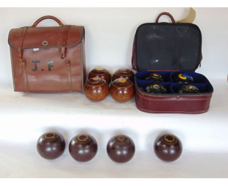 Two bags containing a collection of lawn bowls together with an alabaster lamp.