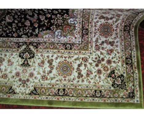 A bright Eastern wool carpet, the pale green ground within white ground borders with overall multi-floral detail, 310 x 200 c