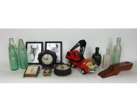 A mixed lot to include a Tonka crane, vintage Bakelite clock, two cased taxidermy scorpions, glass bottles, etc.