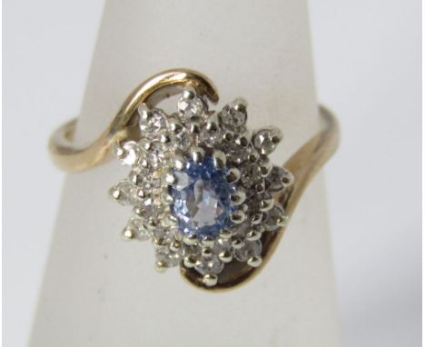 A topaz and diamond cluster 9ct twist ring, size K/L, 3g