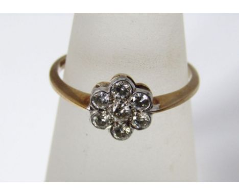 A 9ct gold and diamond daisy ring, size M, 1.5g