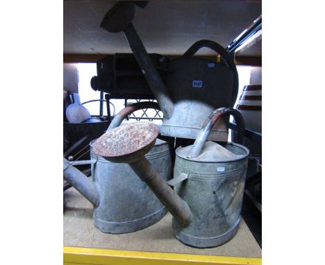 A quantity of vintage galvanised iron watering cans, iron framed table on x shaped support, vintage jerry can, etc