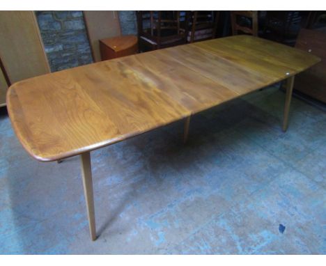 Ercol light elm extending refectory table with folding twin leaves and central leg, 220 cm long