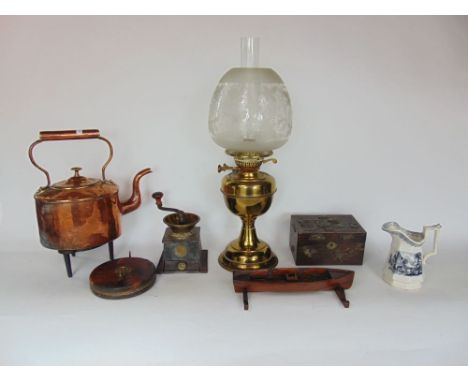 A mixed miscellaneous lot to include antique copper kettle, brass oil lamp with glass shade and flue, an interesting candlest