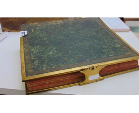 A late 19th century leather bound album with brass edging and clasp containing a collection of topographical and art photogra