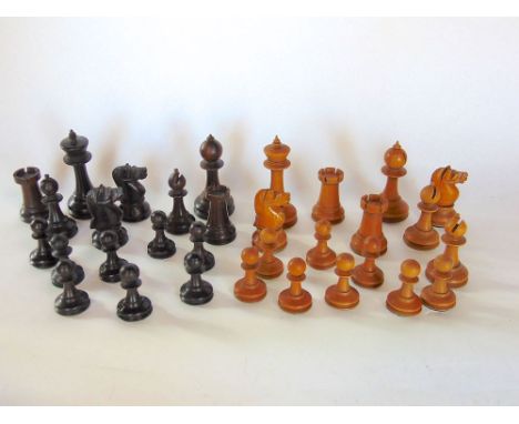 A boxwood and rosewood chess set in the Staunton manner within a games box.