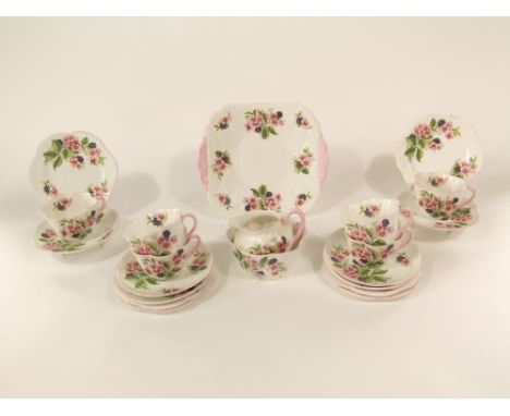 A six place Shelley china tea service with printed blackberry and bramble decoration and scalloped moulding including milk ju