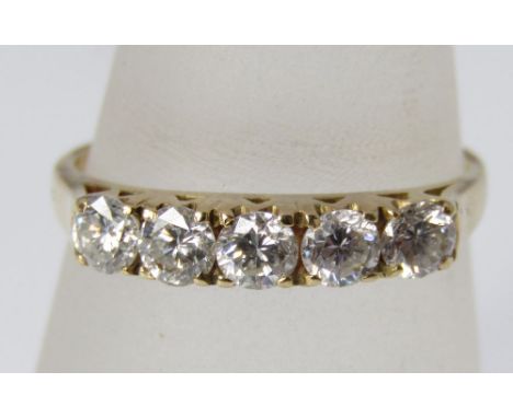 A five stone diamond ring marked 18k, size L/M, 2g