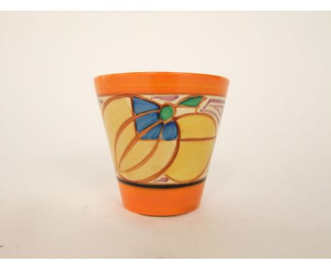 A Wilkinson Ltd Clarice Cliff Fantasque beaker type vase of flared form with stylised fruit and geometric decoration in orang