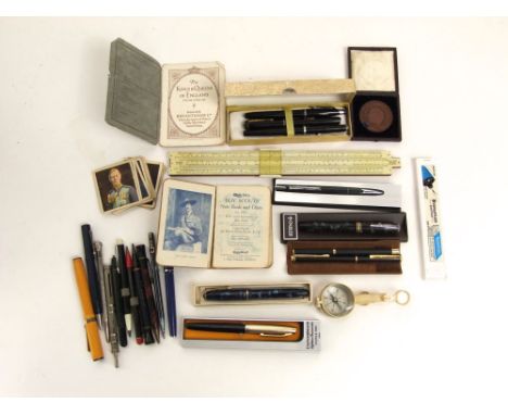 A selection of vintage fountain pens, ball point and others