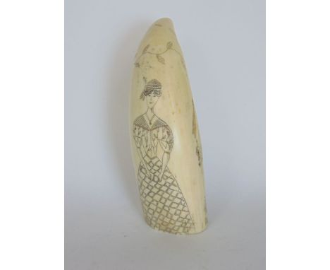 An antique scrimshaw etched with a portrait of a standing lady and a three mast galleon, 13 cm long approx. 