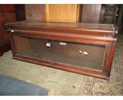 A single glazed section from a Globe Wernicke bookcase with additional top shelf.