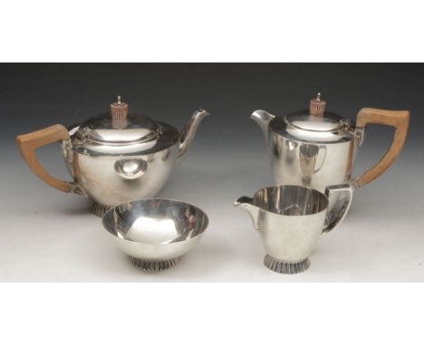 Attractive silver four piece tea service comprising tea pot, water jug, milk jug and sucrier, each of conical form with styli