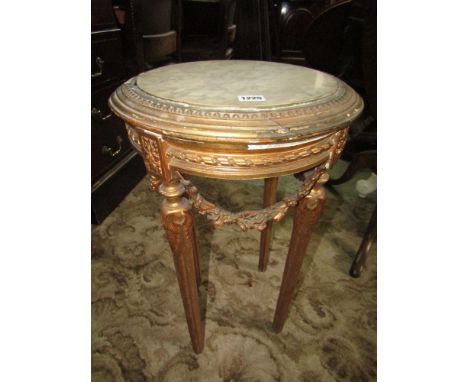 A late 19th century French occasional table or lamp stand of circular form inset with a polished white marble top, raised on 