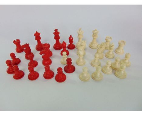 19th century ivory and stained ivory chess set in the manner of Staunton, height of king 5.5 cm, within original gaming box (