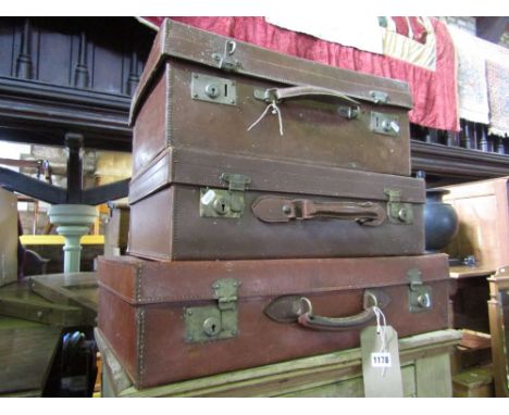 Three good quality heavy leather vintage suitcases.