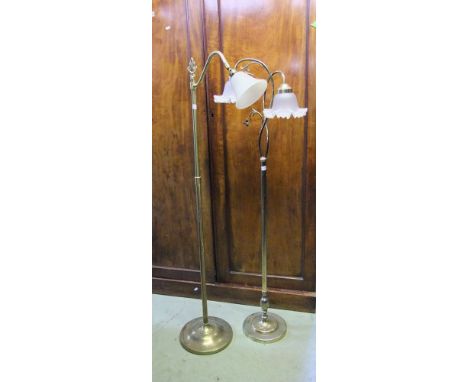 Two brass lamp standards in Edwardian style with etched glass shades.
