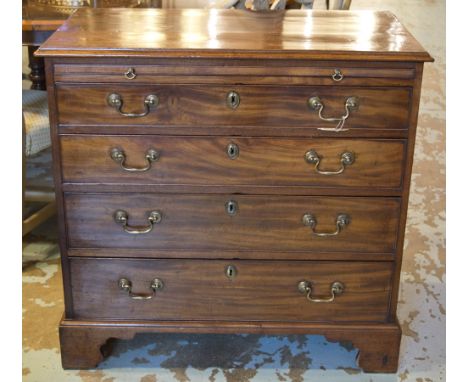 CHEST, George III period mahogany with brushing slide above four long drawers and bracket supports, 87cm W x 48cm D x 85cm H.
