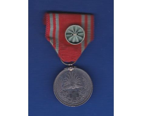 Japanese WWII Red Cross Medal with Officers rosette. An excellent looking item.