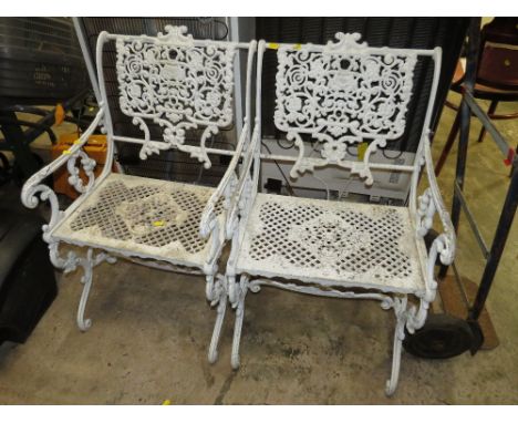 A PAIR OF VINTAGE LIGHT CAST GARDEN CHAIRS