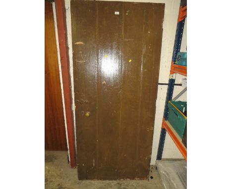 A LARGE VINTAGE WOODEN DOOR