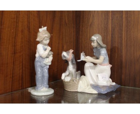 A VINTAGE LLADRO FIGURINE OF A GIRL NURSING HER DOG TOGETHER WITH A NAO FIGURE (2)