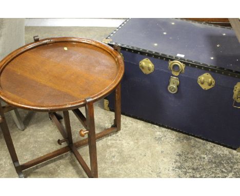 A VINTAGE BLUE PACKING TRUNK PLUS A CIRCULAR OAK CARD TABLE