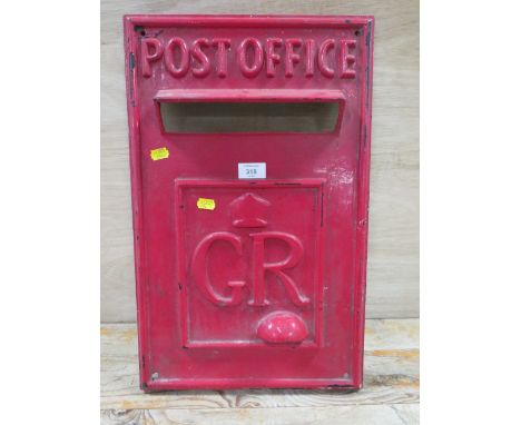 A VINTAGE FIBREGLASS TV PROP OF A POST OFFICE FRONTAGE FOR A WALL POST BOX