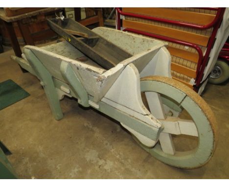 A VINTAGE WOODEN GARDEN BARROW TOGETHER WITH TROUGHS