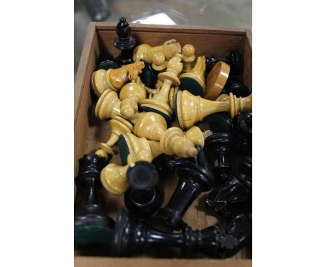 A VINTAGE CARVED WOODEN CHESS SET