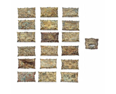 A set of Chinese gilt-bronze harness ornaments, Liao Dynasty (907-1125), comprising: eighteen rectangular plaques and one buc
