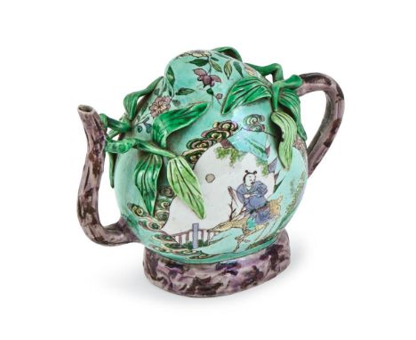 A Chinese Famille Verte 'Cadogan' teapot, 18th/19th century,  of peach form, the handle and spout modelled as gnarled leafy b