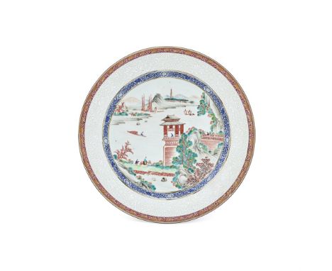 A Chinese Export large dish, Qianlong, painted to the centre in iron-red tones, green and black with a landscape with central