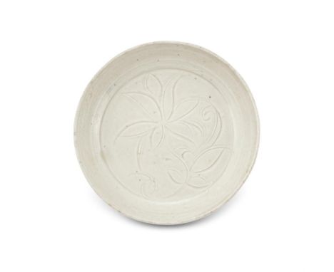 A Chinese Dingyao 'Daylily' small dish, Northern Song or Jin dynasty (11th or 12th century), the lightly potted shallow dish 