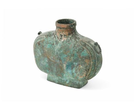 A Chinese heavily cast bronze wine vessel, bianhu, Han dynasty (206 BC- AD 220), the flattened oval body is raised on a sprea