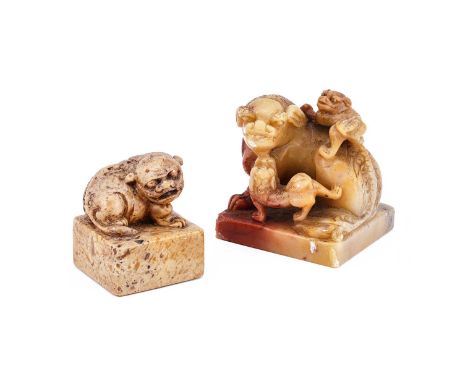 A Chinese soapstone seal, 19th century, the finial carved as a recumbent Buddhist lion, 6.2cm high; and another Chinese soaps