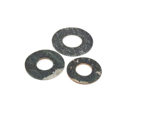 Three Chinese Neolithic spinach jade discs, bi, Qijia culture, circa 2300-1500BC, the largest 14.8cm diameter (3)Provenance: 