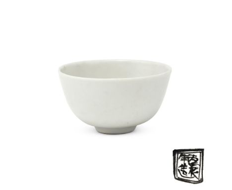 A small Chinese white-glazed tea bowl, Ming Dynasty (1368-1644), the bowl covered overall with white glaze except for a ring-