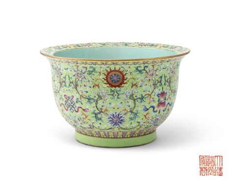 A large Chinese Famille Rose jardinière, decorated on the exterior in bright enamles with stylised lotus bloomsoms alternatin