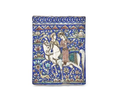 A Qajar moulded tile with two horsemen hunting, Iran, 19th century, of rectangular form, the moulded surface decorated with t