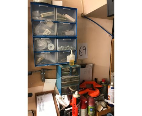 A shelf and cabinets of tools, screws etc. 