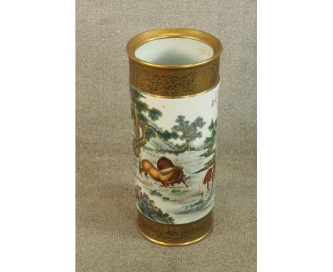 A 19th/early 20th century Chinese porcelain cylindrical stick stand decorated with birds in a landscape, bearing blue charact